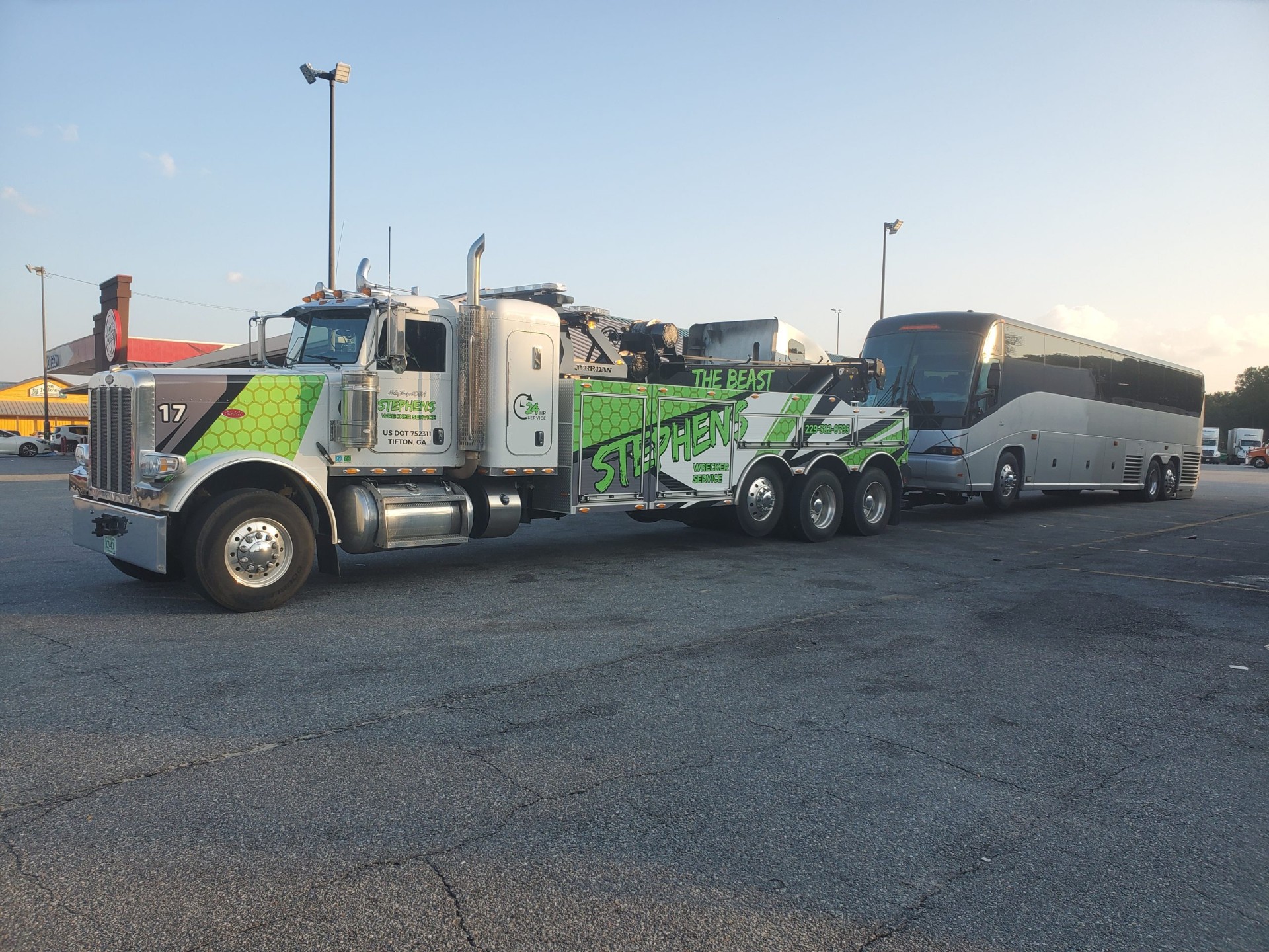 Stephen's Wrecker Service heavy duty wrecker towing a bus