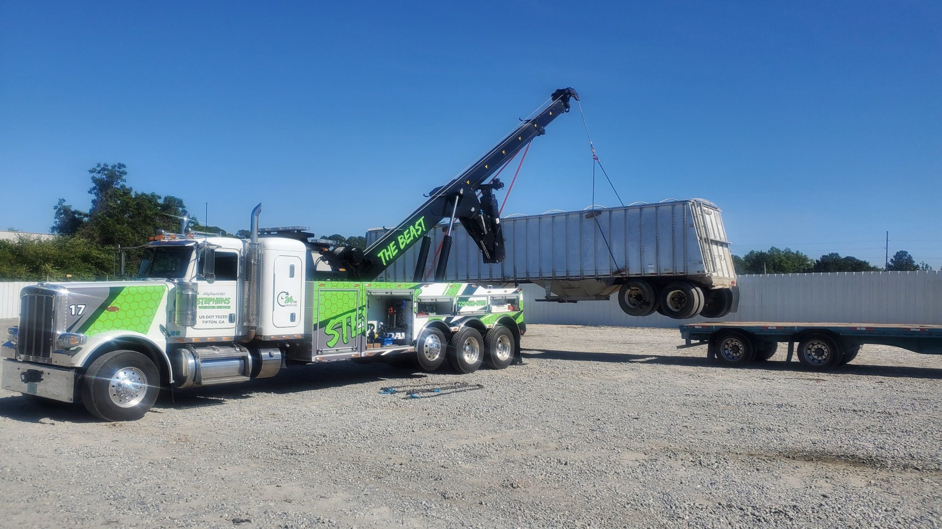 Rotator truck lifting trailer for recovery near Fitzgerald